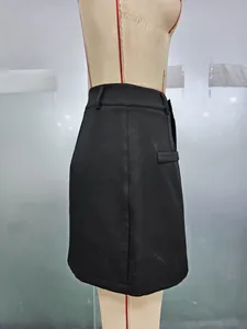 Detail shot of black high-waisted A-line skirt featuring side pocket and belt loops