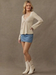 Chic beige long sleeve fitted top with sweetheart neckline and front knot detail