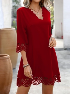 Detailed laser-cut floral pattern and wavy V-neckline on a red A-line vacation dress