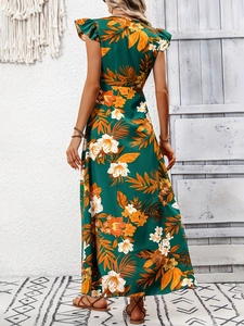 Détail de la robe maxi bohème vert foncé avec imprimé floral, mancherons et fente latérale