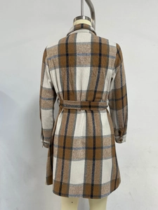 Detail view of the back of a plaid long-sleeve dress with matching waist tie belt