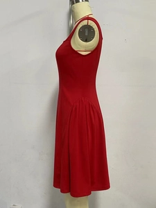 Detail view of the red sleeveless mid-length dress featuring elegant side gathering