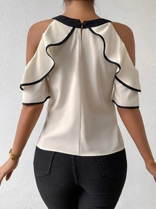 Women's cream off-shoulder tiered blouse with black contrast trim and ruffle sleeves