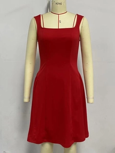 Detail view of the red sleeveless A-line dress with a square neckline on a mannequin