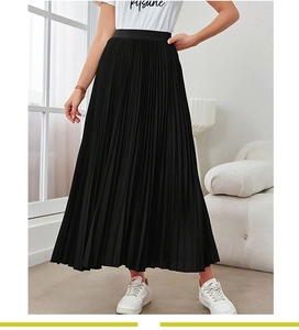 Detail of the high waist elastic band and fine pleated texture on this black maxi skirt