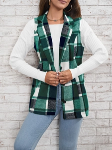 Close-up of green plaid vest with notch lapel and single-breasted buttons on a model