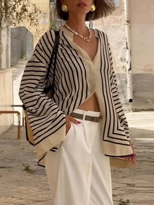 Chic beige knitted striped cardigan with loose fit and elegant French street style vibes