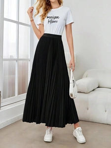 Elegant high-waisted black pleated maxi skirt paired with a white casual t-shirt