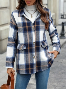 Women's blue plaid shacket with long sleeves and button-down front in a loose fit
