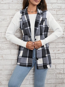 Detail of classic black and white plaid vest jacket with notched collar and texture