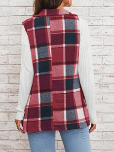 Back view of a long plaid vest in red and blue wool blend over a white sweater