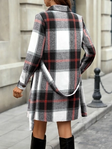 Detail of plaid long-sleeve dress with waist belt and a-line hem from back view