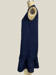 Detailed side view of navy blue sleeveless A-line dress with vertical stripe texture and ruffles
