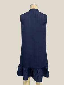 Detail of dark blue striped sleeveless dress with stand collar and ruffled hemline