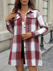 Detail of red and grey plaid shirt dress with amber buttons and classic lapel collar