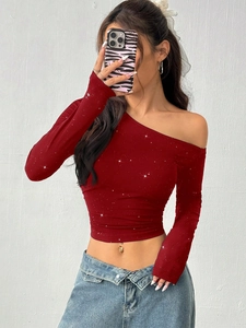Slim fit red off-shoulder long sleeve top with shimmering silver glitter accents