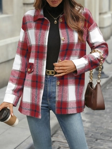 Outdoor street style view of a red and white plaid shacket with wood-style buttons