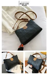 Detail of rhombic textured shoulder bag in black and khaki with adjustable strap
