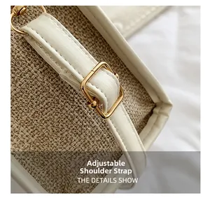 Detail of adjustable white leather shoulder strap with gold metal buckle on canvas tote