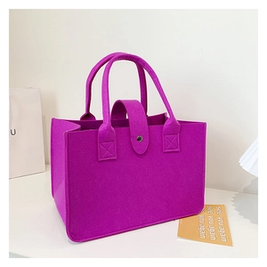 Macro detail of purple felt tote bag showing sturdy reinforced stitching and button closure
