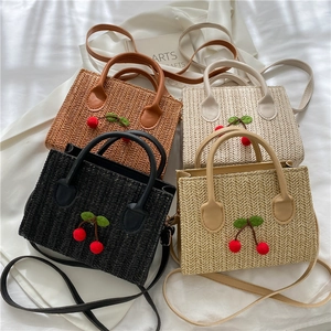 Woven cherry crossbody bags in brown, cream, black, and beige with top handles and straps