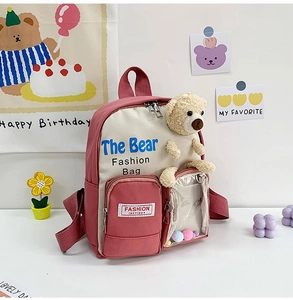 Zaino scolastico rosa e beige con dettaglio di orsetto di peluche e sfere colorate