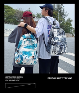Outdoor shot of two graffiti style canvas backpacks featuring abstract urban prints