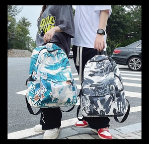 Close-up of street style graffiti backpacks in blue and black with durable canvas texture