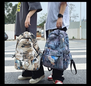 Detail view of graffiti print backpacks with side mesh pockets and durable zippers