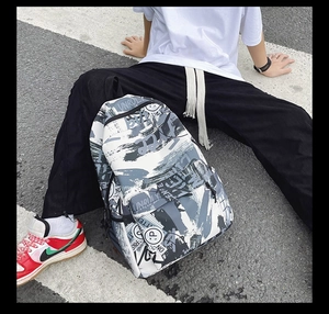 Detailed street style graffiti backpack featuring unique letters and smiley face patterns
