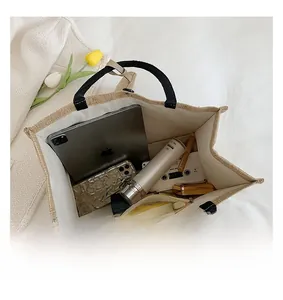 Top view of spacious beige linen tote bag showing interior capacity and daily essentials