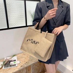Linen tote bag with black rope handles and matching mini pouch for casual style