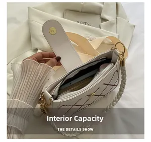 Detail view of the multi-layer interior and magnetic closure of the quilted crossbody bag
