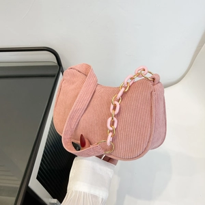 Pink corduroy hobo shoulder bag with stylish thick chain strap in a soft minimalist style