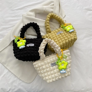 Chic bubble texture tote bags in black, yellow, and white with floral charms