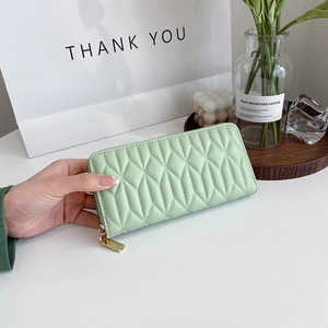 Mint green quilted long zipper wallet with elegant diamond stitching for women