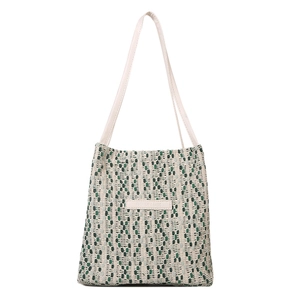 Borsa a spalla intrecciata verde e bianca con motivo pixel vintage e manici in pelle