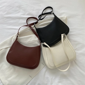 Minimalist faux leather half-moon underarm bags in brown, black and white colors
