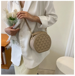 Chic quilted rhombus circular crossbody bag in beige PU leather with golden hardware