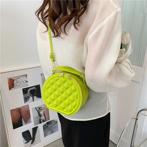 Chic quilted round crossbody bag in bright green PU leather with gold zip details