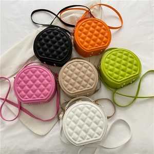 Minimalist quilted diamond stitch round crossbody bag available in six stylish colors