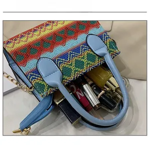 Top view of ethnic woven crossbody bag showing spacious interior with cosmetic items