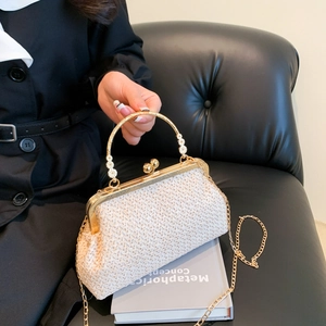 White woven shell evening bag with golden floral ring handle and metallic chain strap