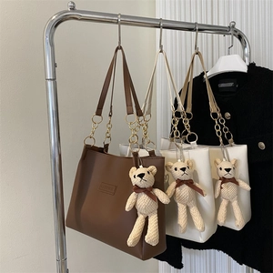 Fashionable PU leather tote bag with chain strap and cute bear pendant in brown and white