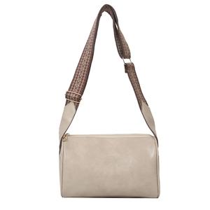 Minimalist beige cylinder crossbody bag with ethnic patterned wide shoulder strap