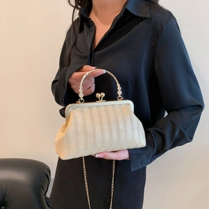 Elegant beige woven frame clutch bag with gold round handle and chain shoulder strap