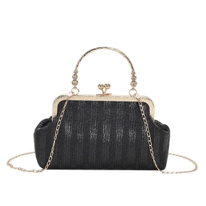 Mini black woven shell crossbody bag with golden metal handles and chain strap