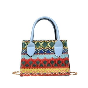 Ethnic embroidery handbag with colorful geometric wave patterns and gold chain strap