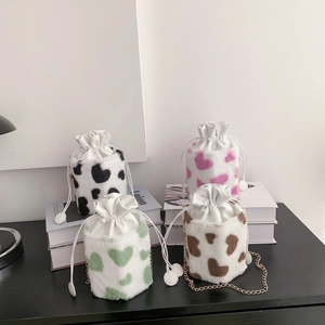 Chic cow print faux fur bucket bags with heart pattern and elegant chain straps