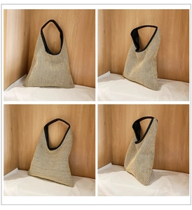 Detail view of beige woven tote bag showing hollow mesh pattern and black faux leather trim